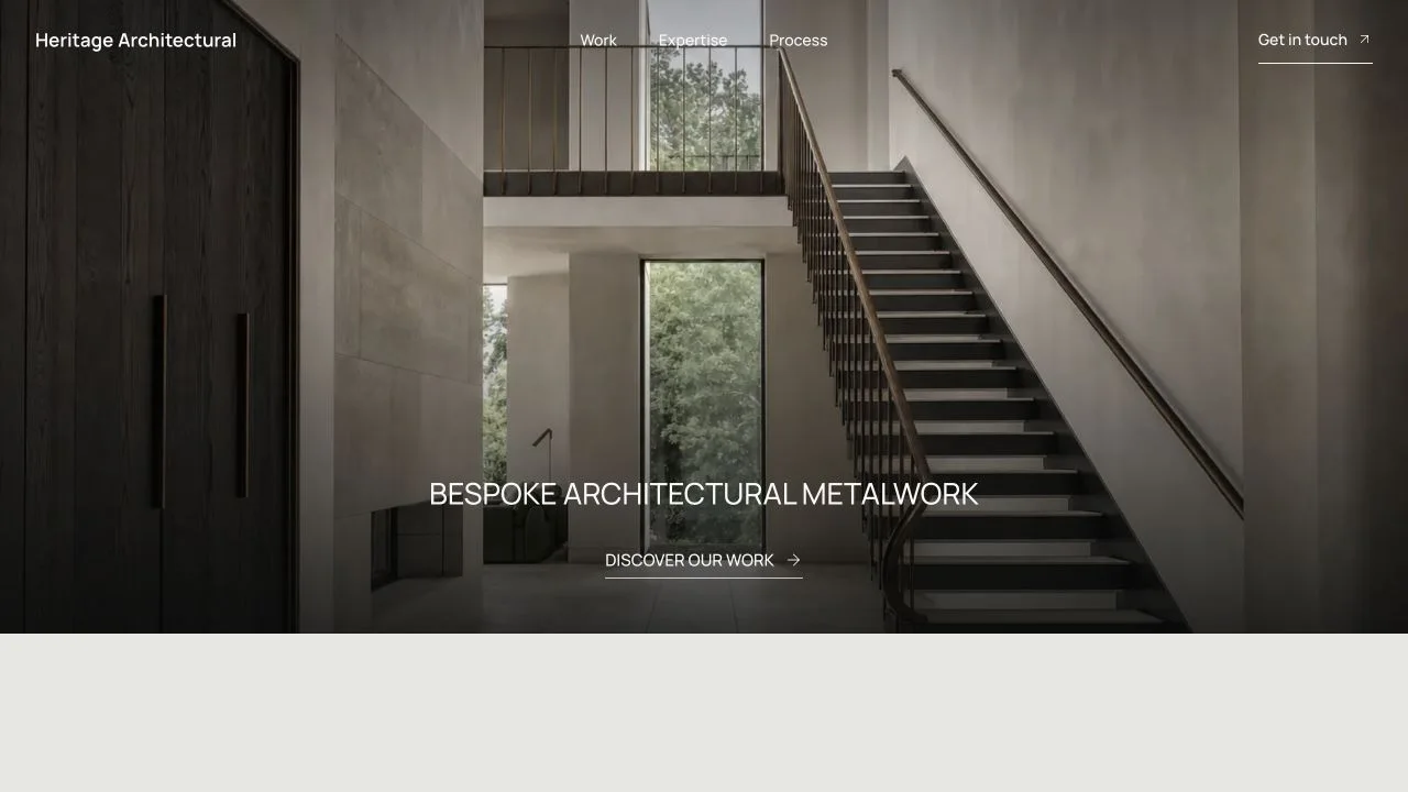 Heritage Architectural homepage showing its staircase hero and concise navigation